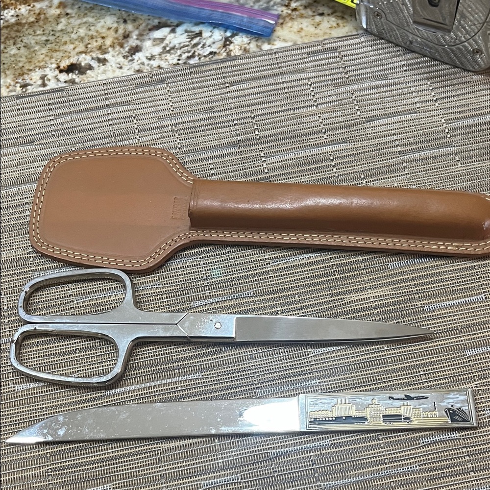 Vintage scissors and letter opener with cowhide case. Quality pieces